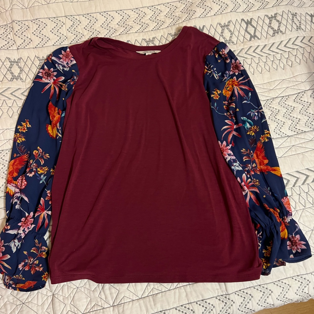 Ladies long sleeve knit top with floral print sleeves,